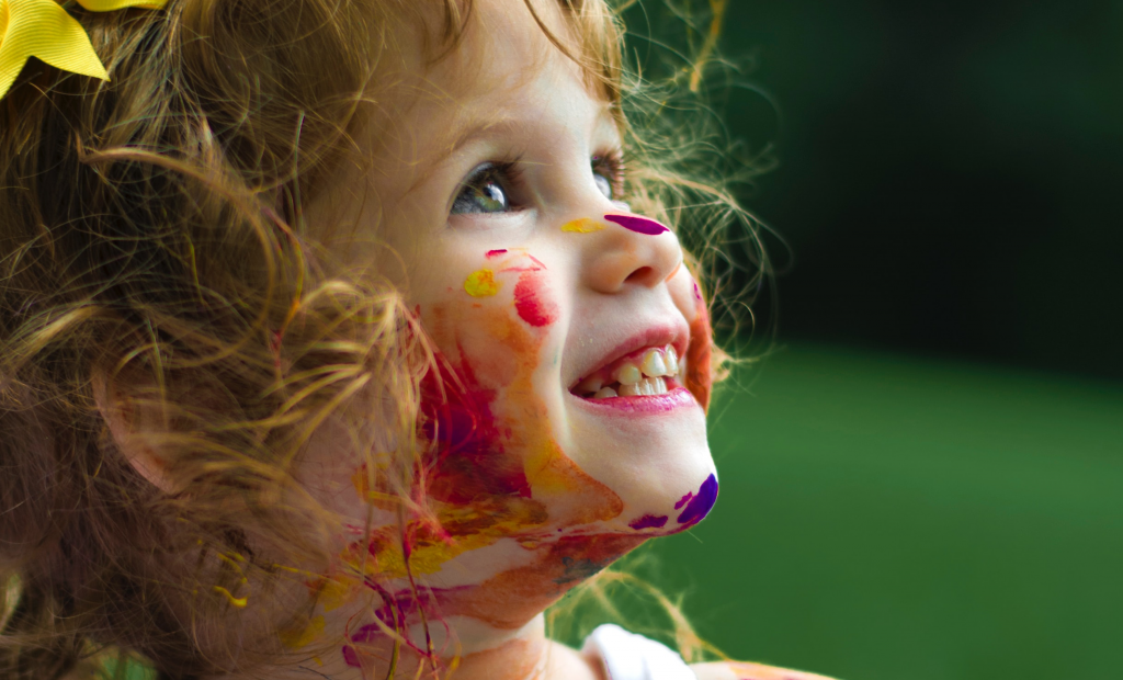cute girl with a paint on her face