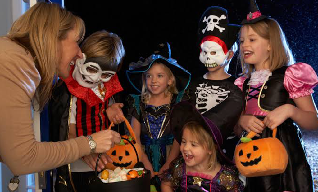 kids wearing Halloween costumes