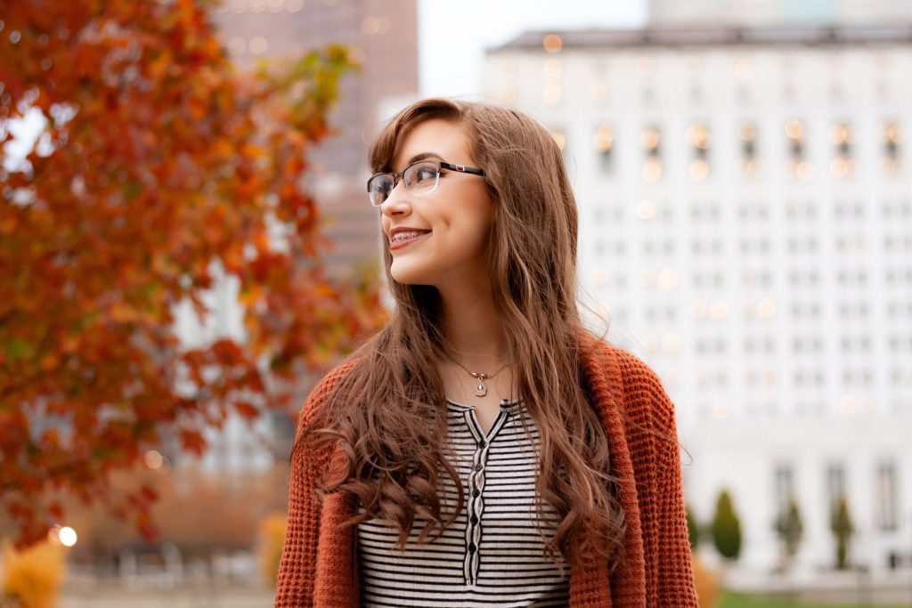woman with dimples wearing an eyeglasses