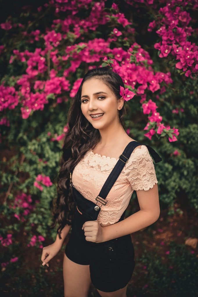 beautiful girl with braces posing in the garden