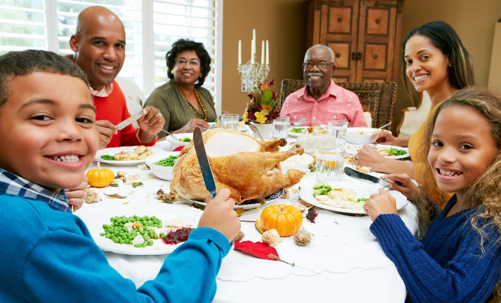 a happy family having a meal