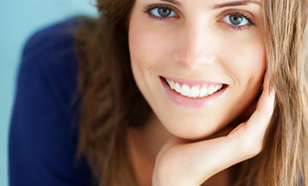 woman with tantalising eyes is smiling