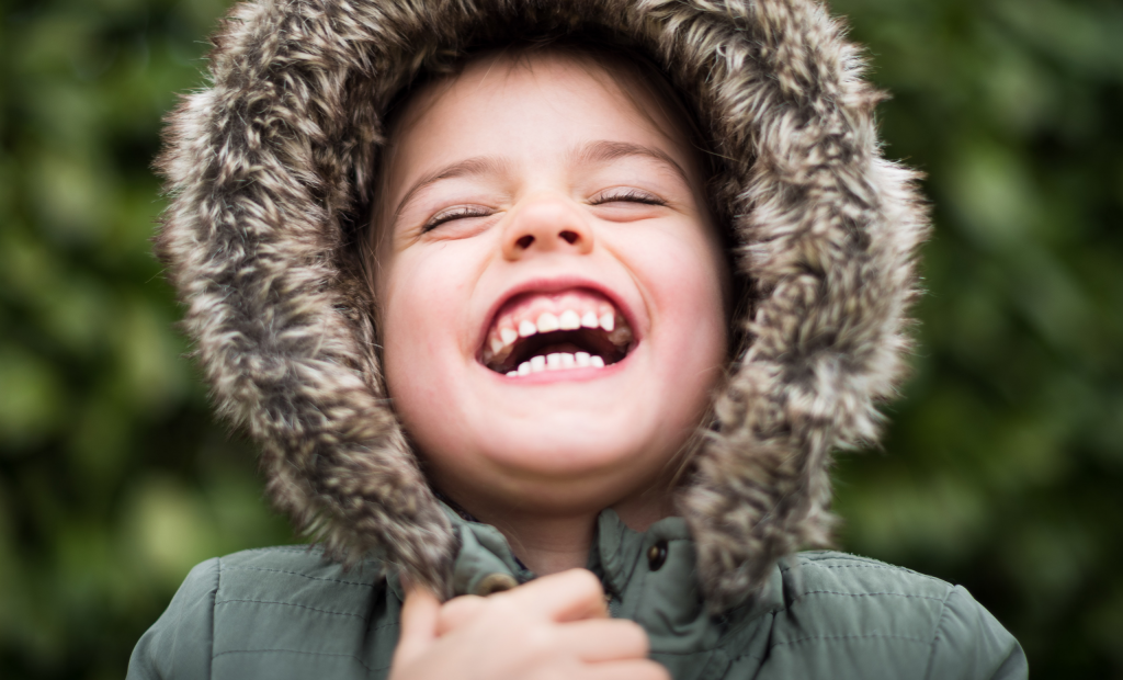 cute kid wearing a trench coat