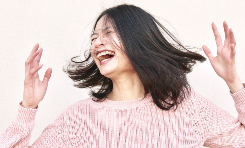 cheerful woman wearing white tops
