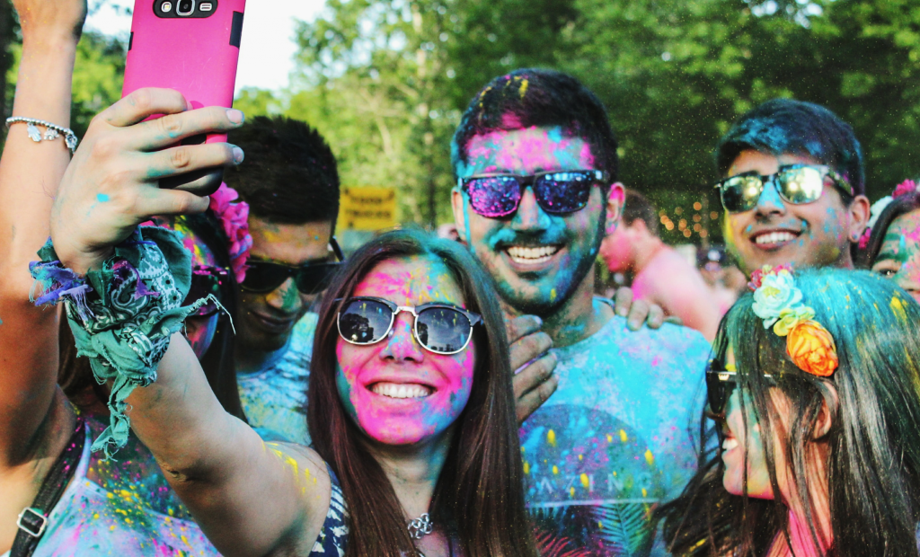 people with colours during fun run